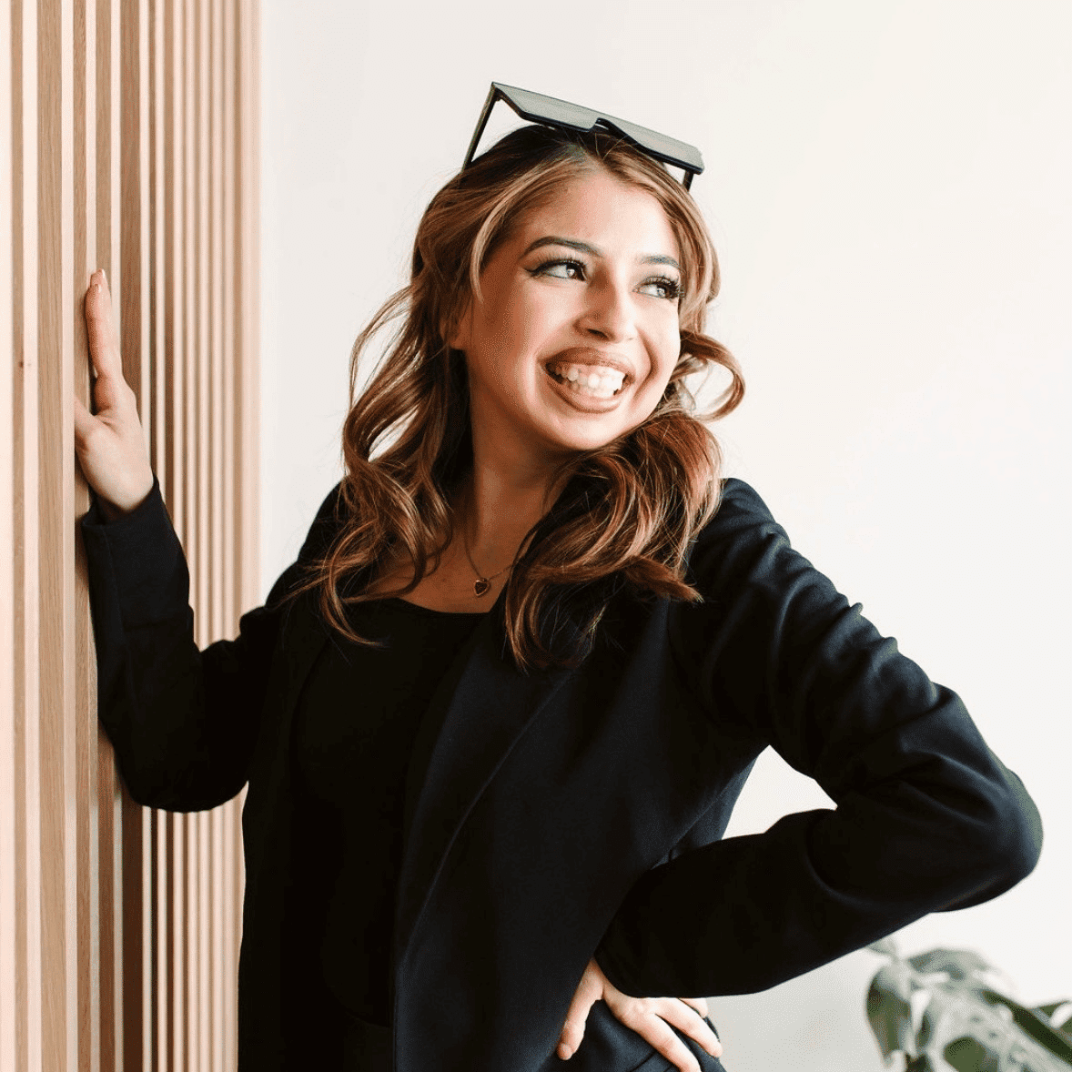 Portrait of Janely, a professional stylist at The Collective Beauty Studio, showcasing their expertise and style.