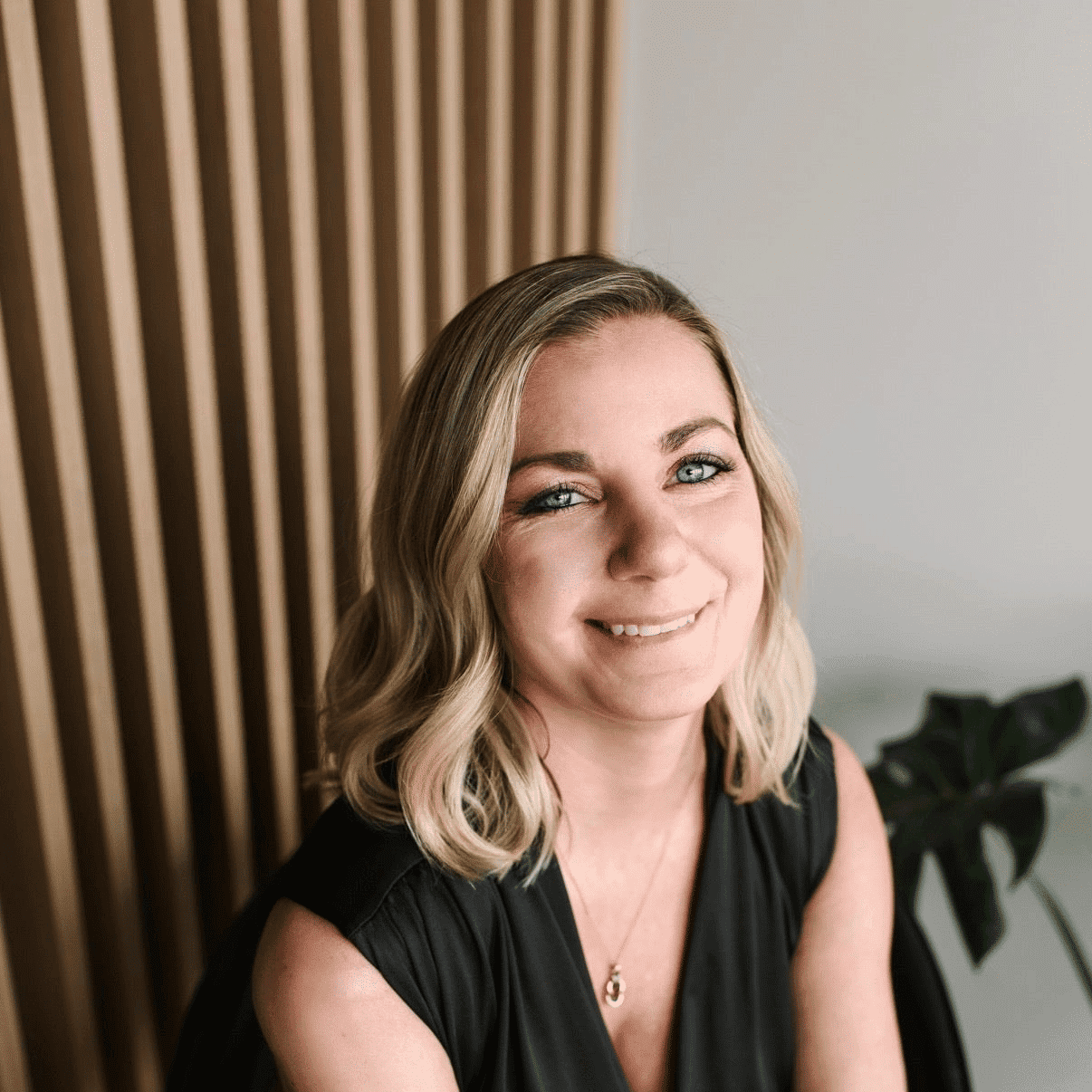 Portrait of Allie, a professional stylist at The Collective Beauty Studio, showcasing their expertise and style.